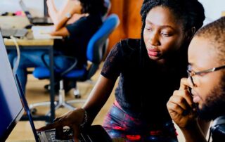 Summify: The Impetus Behind Startup Visa Canada, image showing a woman and a man looking at a laptop