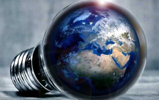 Immigrants Are Crucial to Innovation, US Study Says, image showing planet earth placed inside a lightbulb