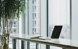 Canada Needs a Visa for Immigrant Entrepreneurs, image showing empty seat in front of a laptop by the window
